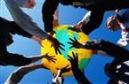 businessmen holding up globe