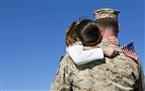 military man hugs daughter