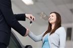 smiling car customer shaking hands with keys
