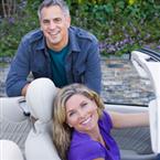 smiling-couple-with-convertible